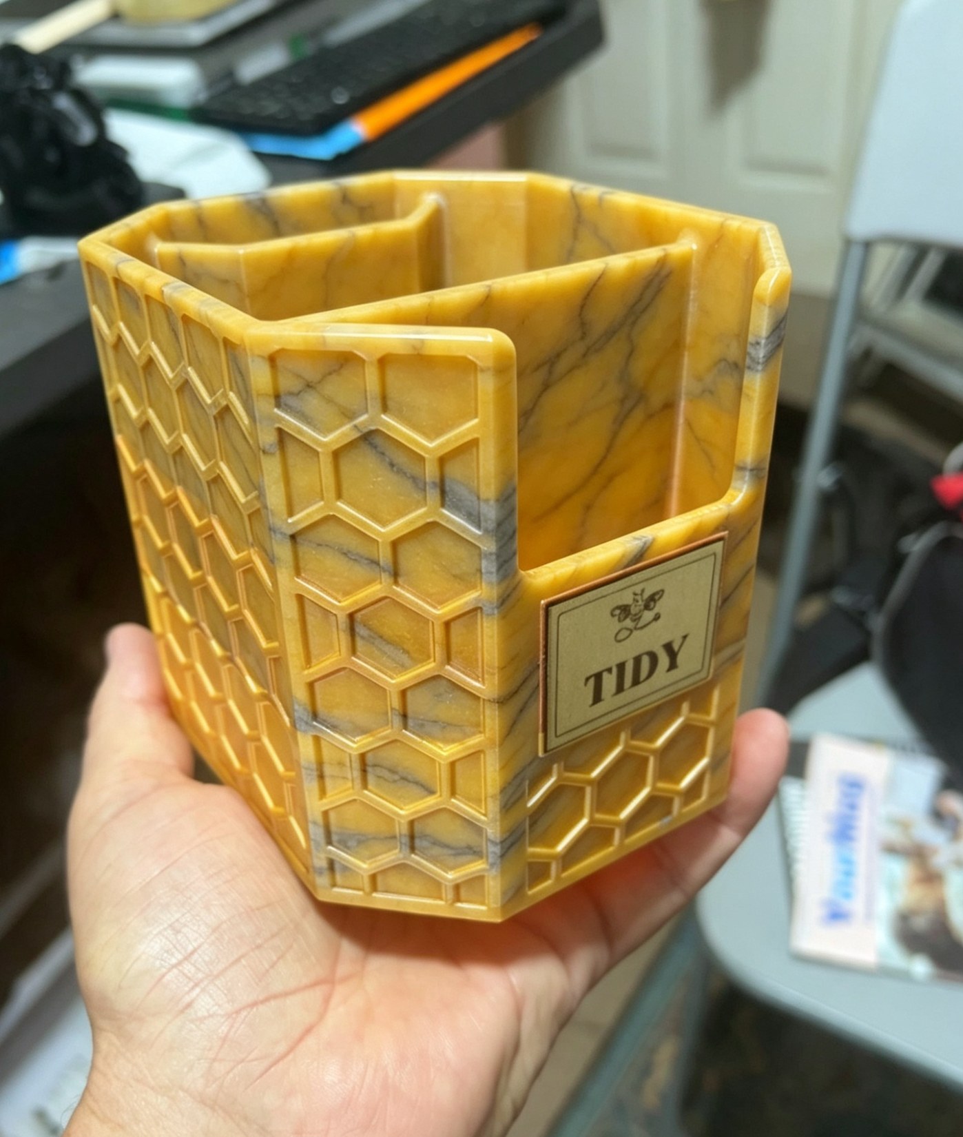 Honey-coloured Bumble Bee Hollow desk tidy with honeycomb pattern, black detail lines and a small TIDY label.